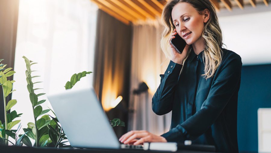 Woman working at standup desk